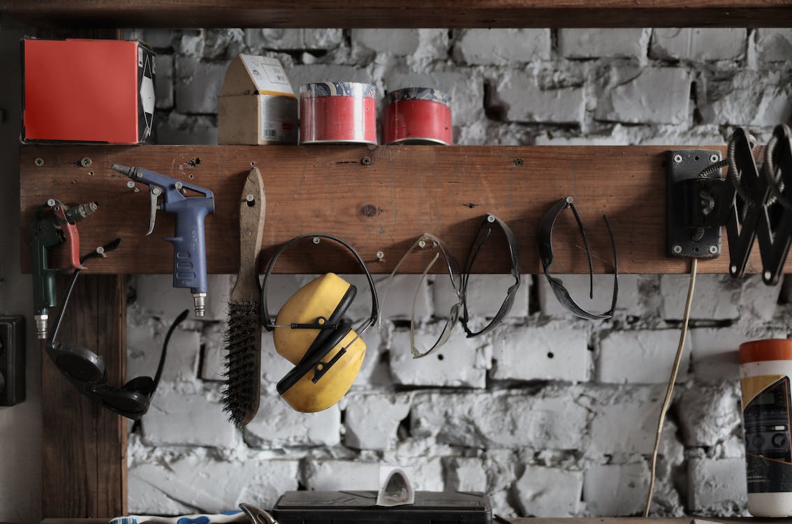 DIY Invention Station: A photo of a child surrounded by various materials and tools, showcasing their own DIY invention station.